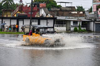 Hurricane Melissa live updates: ‘Extremely dangerous’ storm strengthens towards Cuba after devastating Jamaica A car drives through a flooded street ahead of Hurricane Melissa's arrival in Santiago de Cuba, Cuba, on Tuesday.